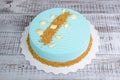 Light blue chocolate velour mousse cake with seashells