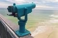 Light blue coin operated telescope mounted on the Pensacola fishing pier Royalty Free Stock Photo