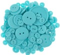 Light blue colored sewing buttons isolated on white Royalty Free Stock Photo