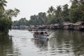 Light Blue colour boat moving on backwaters of Alleppey in kerala