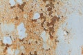 Light blue corroded metal background. Rusty and scratched painted metal wall. Rusty metal background with streaks of rust Royalty Free Stock Photo