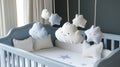 A light blue crib with white bedding, accented by a soft mobile with Royalty Free Stock Photo