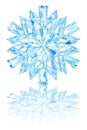 Light blue crystal snowflake on glossy white background Royalty Free Stock Photo