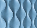 Light blue 3D interior decorative wall panel with unusual wavy geometric shape. Denim background with wave pattern