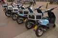 Light blue delivery motorcycles parked together in a row at Amsterdam Royalty Free Stock Photo