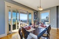 Light blue dining area with sliding glass door