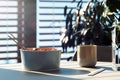 Light dish plate with chopsticks and stylish mug on wooden table. 3d rendering.