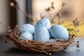 Light blue easter eggs with dark speckles resting in a bird nest Royalty Free Stock Photo