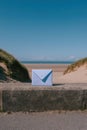 Serene Coastal Message A Light Blue Envelope by the Sea Royalty Free Stock Photo