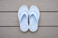 Light Blue Flip Flops on Gray Deck Background Royalty Free Stock Photo