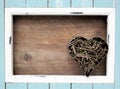 Light blue frame and rusted nails, in a heart shape Royalty Free Stock Photo