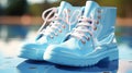 Light blue galoshes on a blue background