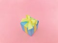 Light blue gift box on pink background. Royalty Free Stock Photo