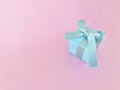 Light Blue gift box on pink background. copy space. Royalty Free Stock Photo