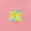 Light blue gift box on pink background. square. Royalty Free Stock Photo