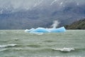 Light blue iceberg on lake Grey at Torres del Paine national park in southern Chile. Royalty Free Stock Photo