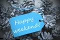 Light Blue Label On Fir Cones With Happy Weekend