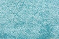 Light blue matte background of suede fabric, closeup. Velvet texture of seamless denim textile, macro. Structure of sky Royalty Free Stock Photo