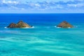 Light blue ocean water and two small islands. Blue sky with white clouds. Beautiful landscape of Oahu, Hawaii Royalty Free Stock Photo