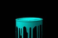 Light Blue oil paint flowing over the part of metal bucket. Isolated over black color Royalty Free Stock Photo