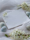 Light blue painted easter eggs on white background with copy space