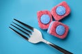 Light blue plate with fork and dishwasher detergent tablets, top view Royalty Free Stock Photo