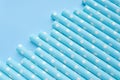 Light blue polka dot paper straws on a light blue background. Drinking straws, Royalty Free Stock Photo