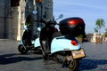 Light blue rental electric scooters in the Castle district of Budapest in historic surrounding.