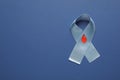 Light blue ribbon with paper blood drop on color background, top view and space for text. Diabetes awareness