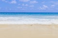 Light blue sea waves on clean sandy beach, Tropical white sand beach and soft sunshine background Royalty Free Stock Photo