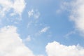 Light blue sky background with white clouds frame