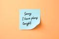 Light blue sticky note with phrase Sorry, I Have Plans Tonight on pale orange background Royalty Free Stock Photo