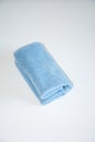 Light blue towel roll placed on a pure white background, with a soft texture Royalty Free Stock Photo