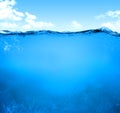 light blue transparent water wave surface with splash bubble on blue Royalty Free Stock Photo