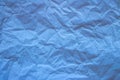 Light blue trendy paper texture. Crumpled paper in light blue color.