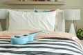 Light blue ukulele on striped bedding Royalty Free Stock Photo