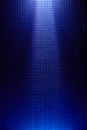 A light blue vertical ray of light crosses a blue background to a point in the middle Royalty Free Stock Photo