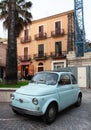 Vintage Fiat 500 car parked in old town of Foggia, Italy