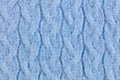 Light Blue woolen knitted ornamented fabric background