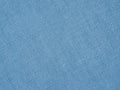 Light blue woven surface closeup. Linen textile texture. Fabric background. Textured braided backdrop or wallpaper. Macro