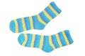 Light blue and yellow terrycloth striped socks are on white background