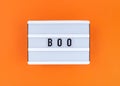 Light box with Boo word on an orange background.