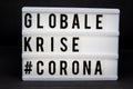 A light box with the inscription: GLOBALE  #CORONA with white background Royalty Free Stock Photo