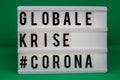 A light box with the inscription: GLOBALE  #CORONA with white background Royalty Free Stock Photo