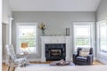 A light and bright open concept living room den with vaulted ceilings in a new construction house