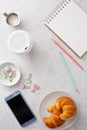 Light and bright tabletop with a smartphone Royalty Free Stock Photo