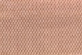 Light brown background from soft fleecy fabric closeup. Texture of textile macro Royalty Free Stock Photo