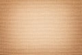 Light brown background from a textile material with wicker pattern, closeup