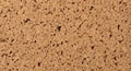 Light brown cork texture featuring a densely packed pattern of irregular, angular pieces. The cork Royalty Free Stock Photo