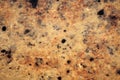 Light brown granite with black and white small inclusions, close-up of polished flat surface of natural stone Royalty Free Stock Photo